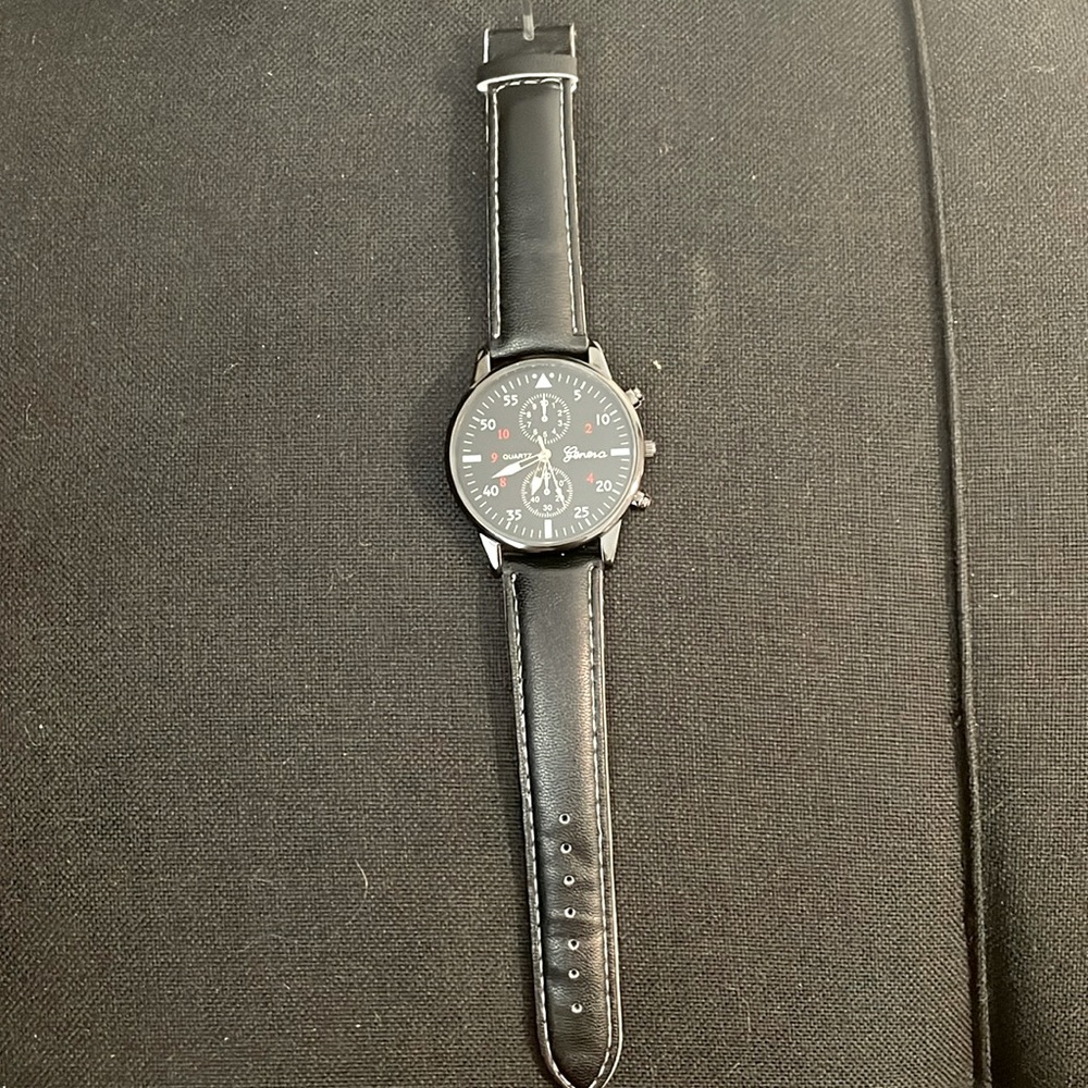 Black leather strap watch
